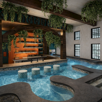 Indoor pool area with a bar, hanging plants, and large windows providing natural light.