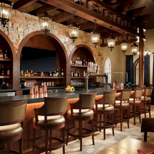 A cozy, dimly lit rustic bar with wooden shelves full of bottles, a polished counter, and warm ambient lighting, inviting a relaxing drink.