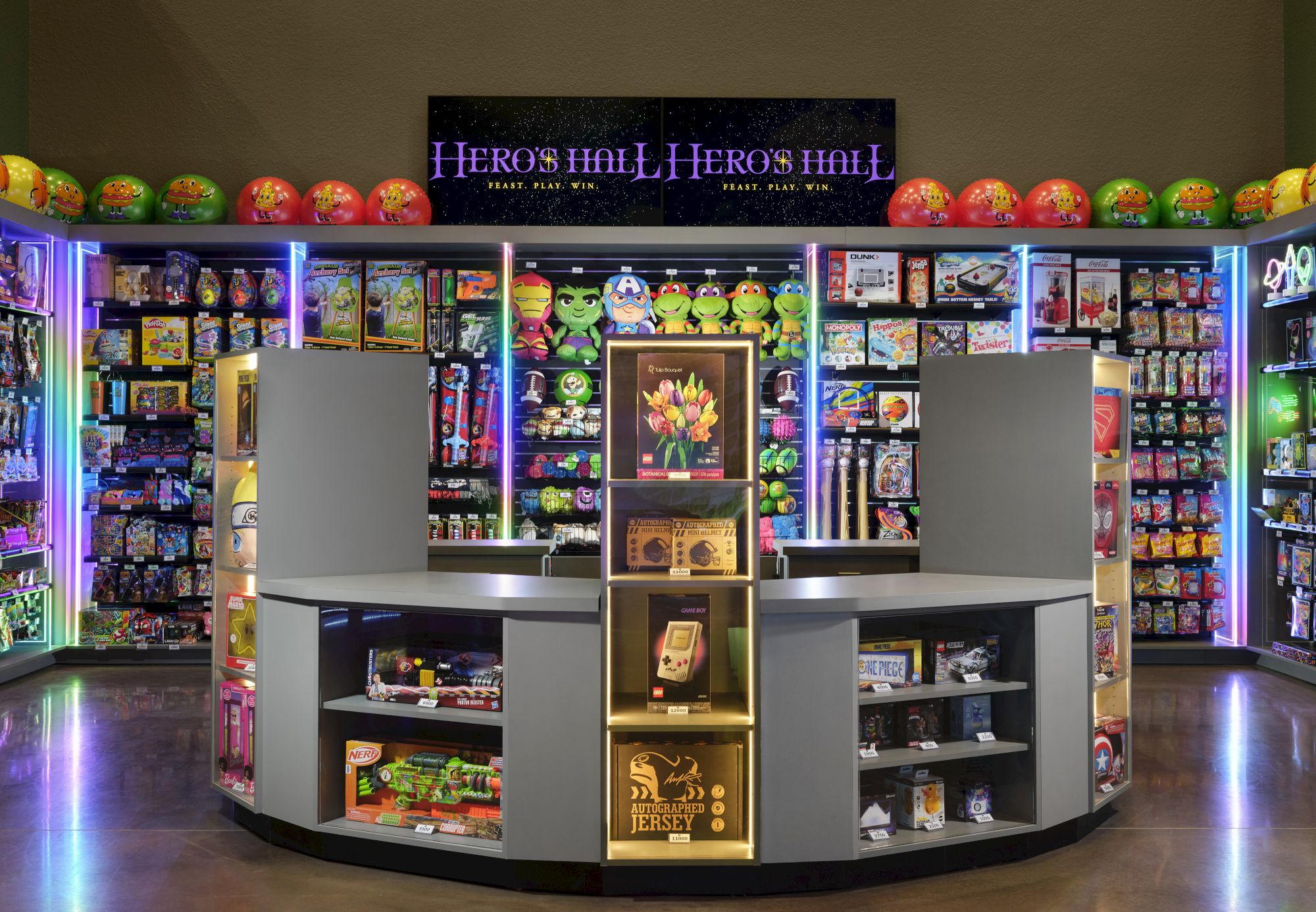 A brightly lit game store or arcade with colorful shelves, arcade prizes, and a central circular checkout area, led by a neon sign.