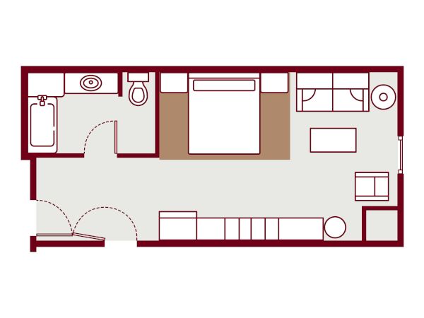 A small apartment floor plan with a bedroom, bathroom, and living area; entry door, bed, sofa, desk, and kitchenette along one wall.