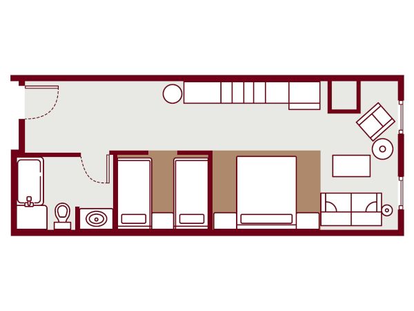 A compact floor plan: entry on left, small bathroom, two single beds, a double bed, along with a kitchenette and seating area at the far right, all in a narrow rectangular layout.